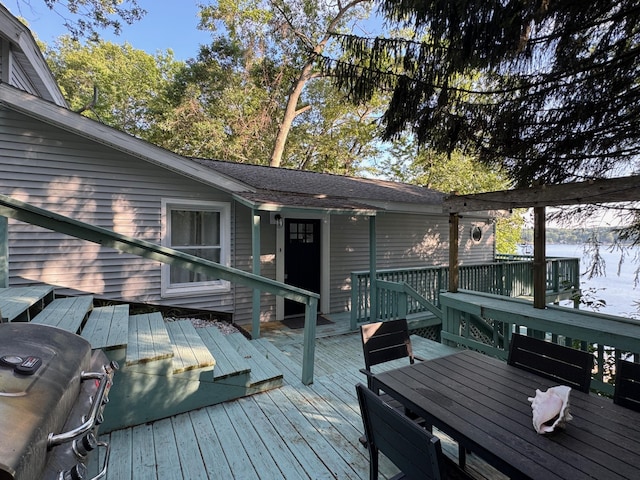 7075 N Poplar Rd, Michigan, MI 49411 - wooden terrace featuring outdoor dining space