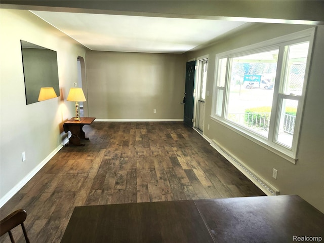 1260 Hira St, Waterford, MI 48328 - empty room with a baseboard radiator, hardwood / wood-style floors, and arched walkways