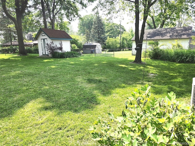 1260 Hira St, Waterford, MI 48328 - view of yard featuring a storage unit