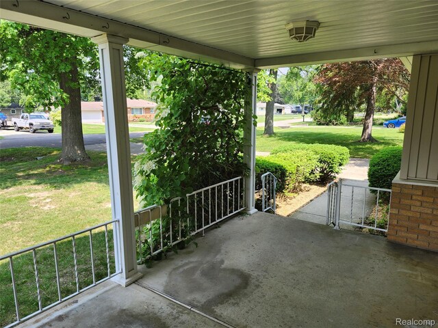1260 Hira St, Waterford, MI 48328 - covered porch featuring a lawn