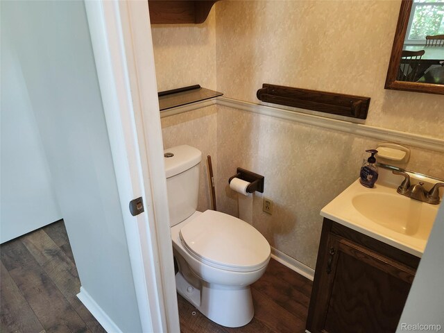 1260 Hira St, Waterford, MI 48328 - half bathroom with wood finished floors, vanity, and a wainscoted wall