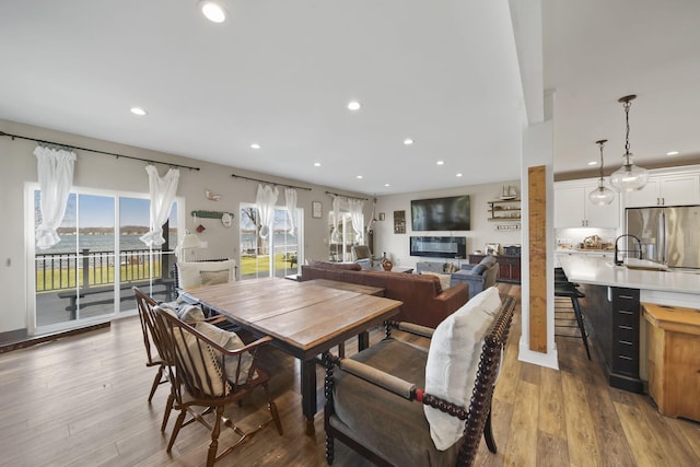 dining room with wood finished floors and recessed lighting