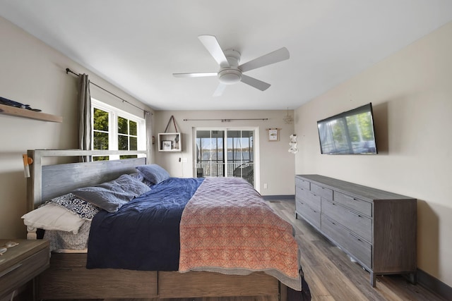 bedroom with ceiling fan, access to exterior, baseboards, and wood finished floors
