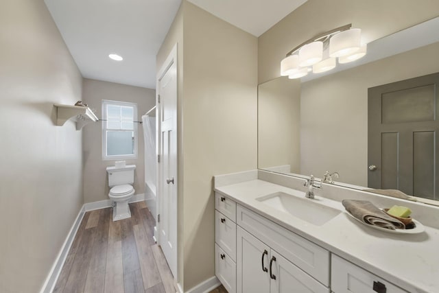 full bath with vanity, baseboards, shower / tub combo with curtain, toilet, and wood-type flooring