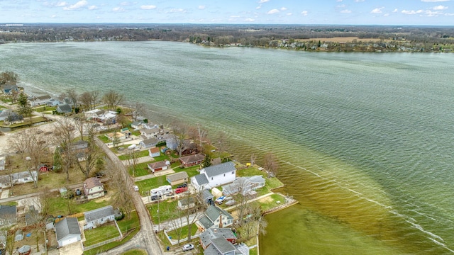 drone / aerial view featuring a water view and a residential view
