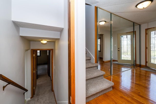2532 Ridgewood Trl, Berrien Springs, MI 49103 - foyer entrance with a textured ceiling, wood finished floors, baseboards, and stairway
