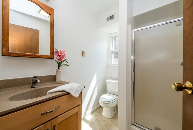 2532 Ridgewood Trl, Berrien Springs, MI 49103 - full bathroom featuring a shower stall, vanity, visible vents, toilet, and baseboards