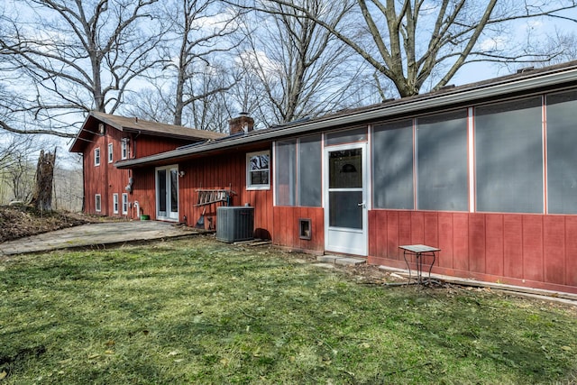 2532 Ridgewood Trl, Berrien Springs, MI 49103 - rear view of property with central AC, a lawn, and a chimney