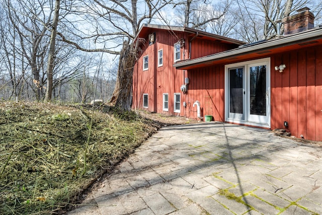 2532 Ridgewood Trl, Berrien Springs, MI 49103 - rear view of house featuring a patio area and a chimney