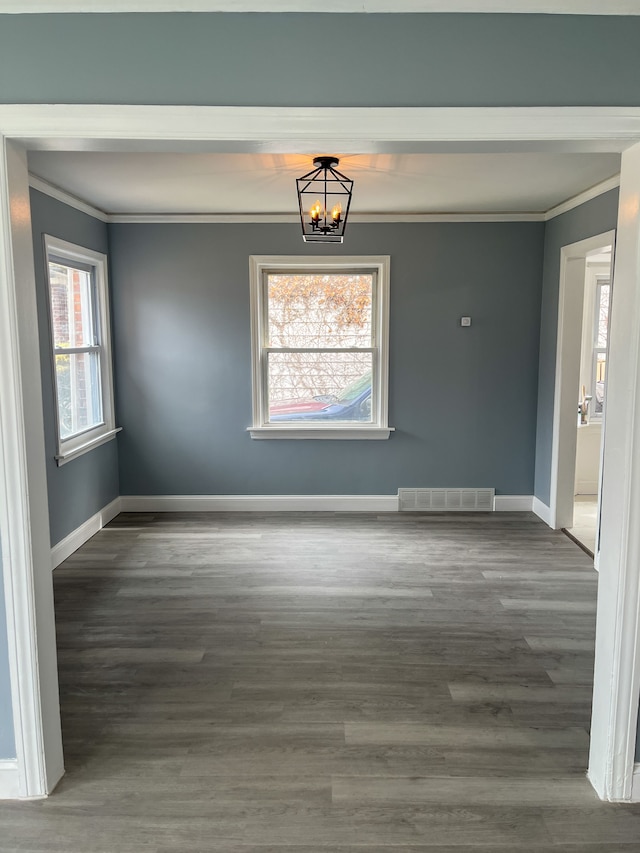 4651 Berkshire St, Detroit, MI 48224 - unfurnished dining area featuring visible vents, crown molding, baseboards, and a notable chandelier