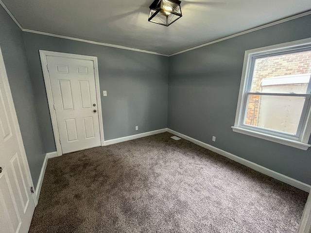 4651 Berkshire St, Detroit, MI 48224 - spare room featuring carpet floors, crown molding, visible vents, and baseboards