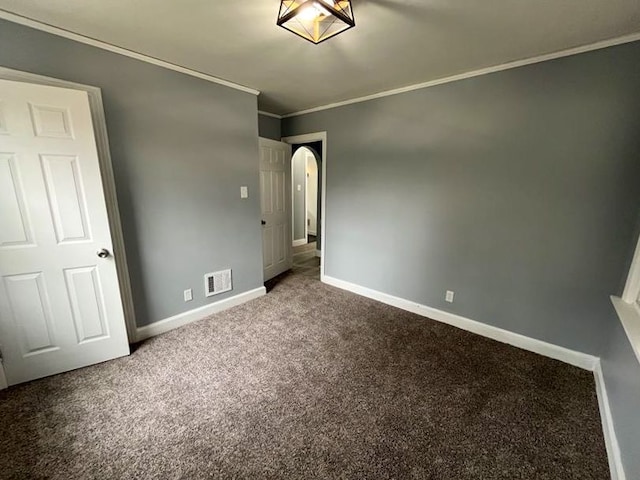 4651 Berkshire St, Detroit, MI 48224 - unfurnished bedroom featuring arched walkways, visible vents, carpet, baseboards, and crown molding