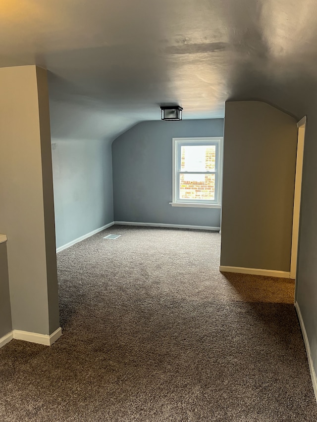4651 Berkshire St, Detroit, MI 48224 - additional living space with vaulted ceiling, carpet floors, and baseboards