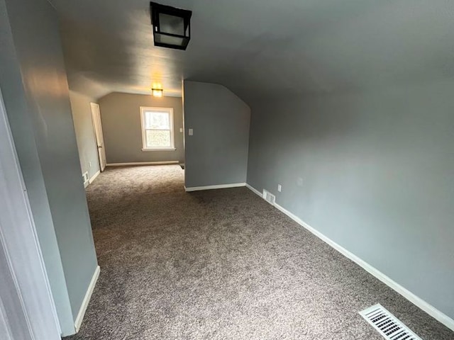 4651 Berkshire St, Detroit, MI 48224 - additional living space with carpet floors, lofted ceiling, visible vents, and baseboards