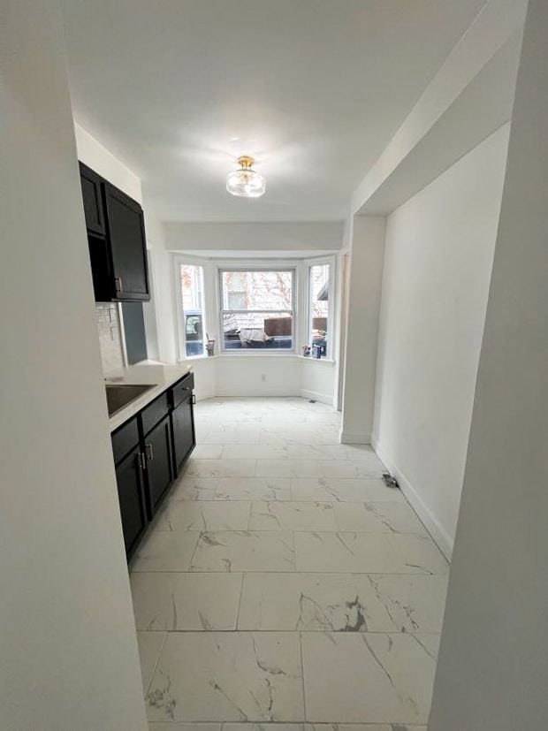 4651 Berkshire St, Detroit, MI 48224 - corridor with marble finish floor and baseboards