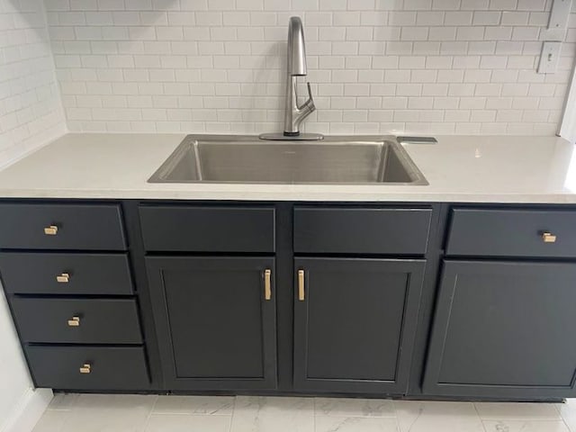 4651 Berkshire St, Detroit, MI 48224 - kitchen with light countertops, marble finish floor, and a sink