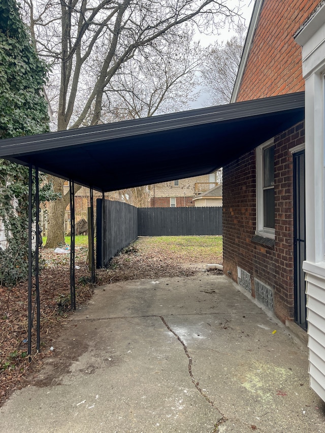 4651 Berkshire St, Detroit, MI 48224 - view of car parking with a carport and fence