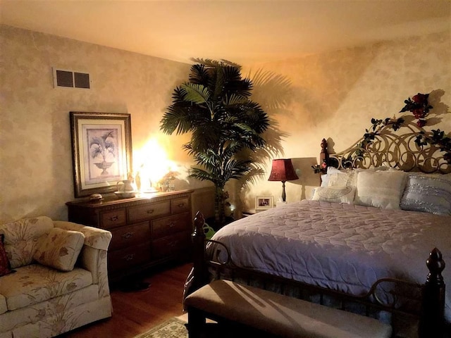 bedroom featuring dark wood-style floors