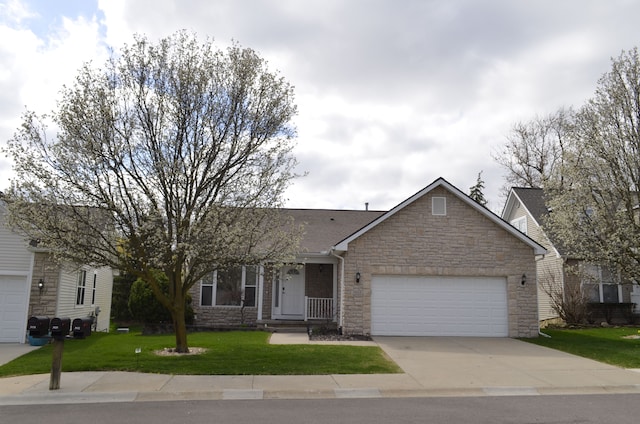 ranch-style home featuring an attached garage, a front yard, driveway, and stone siding
