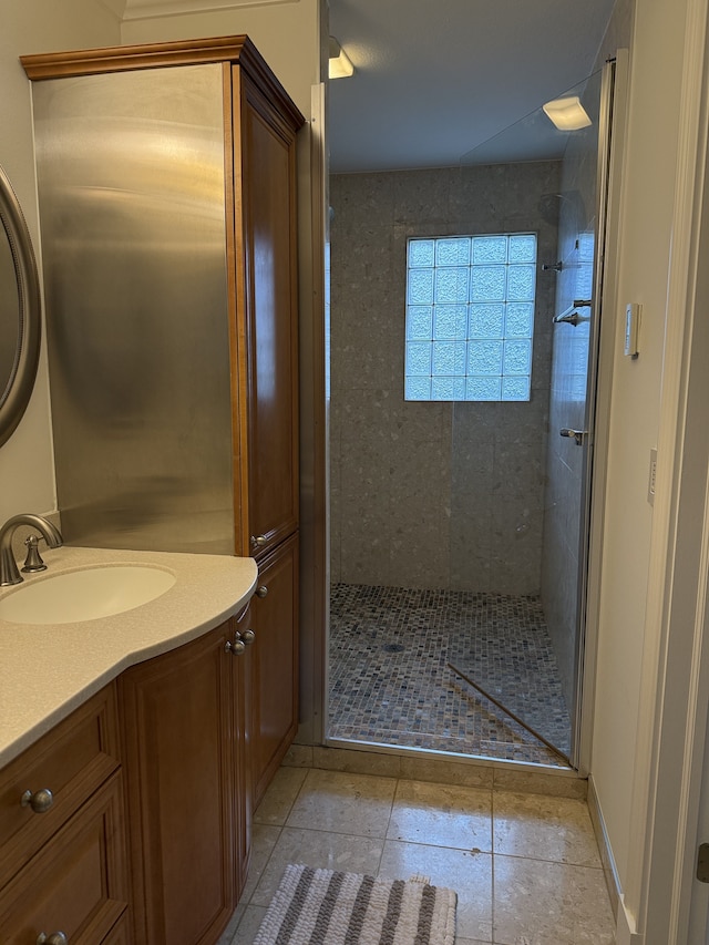 full bath with tile patterned flooring, vanity, and a shower stall