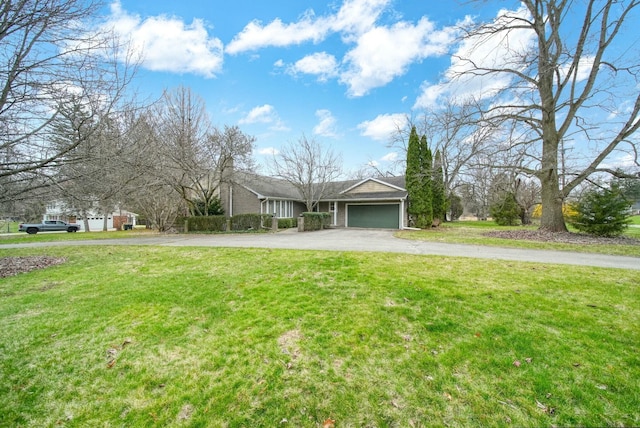 single story home with an attached garage, driveway, and a front lawn