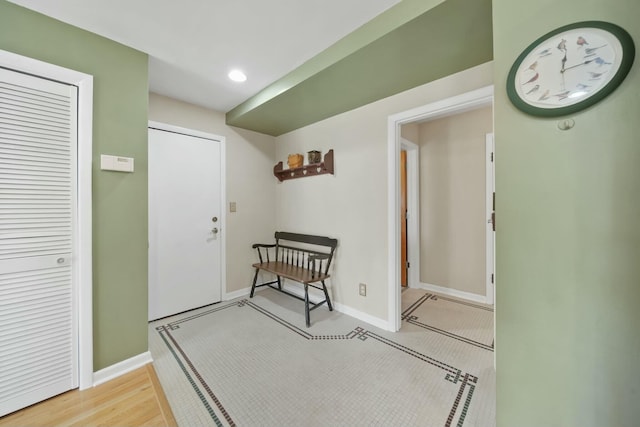foyer featuring baseboards and recessed lighting