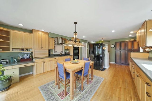 kitchen with recessed lighting, light wood-style flooring, light brown cabinets, and black appliances