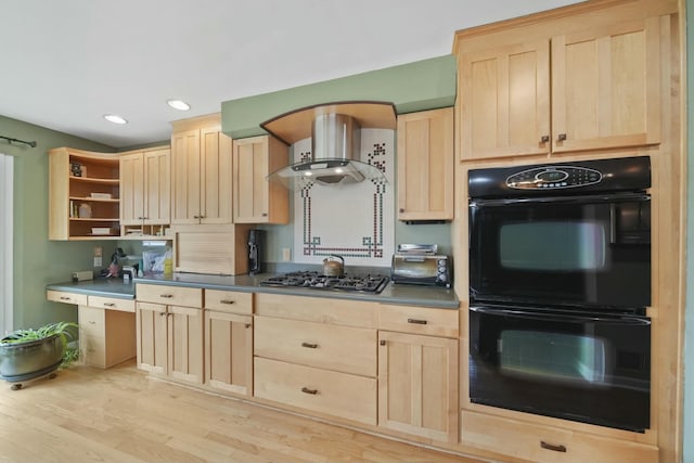 kitchen featuring wall chimney exhaust hood, gas stovetop, light brown cabinets, and dobule oven black