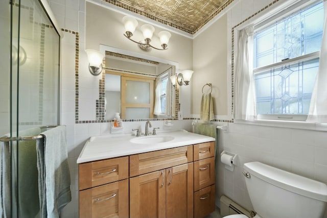 bathroom with tile walls, a wealth of natural light, toilet, a shower stall, and an ornate ceiling