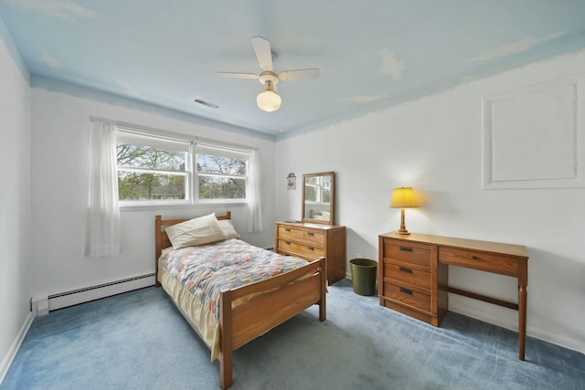 carpeted bedroom featuring visible vents, ceiling fan, a baseboard heating unit, and baseboards