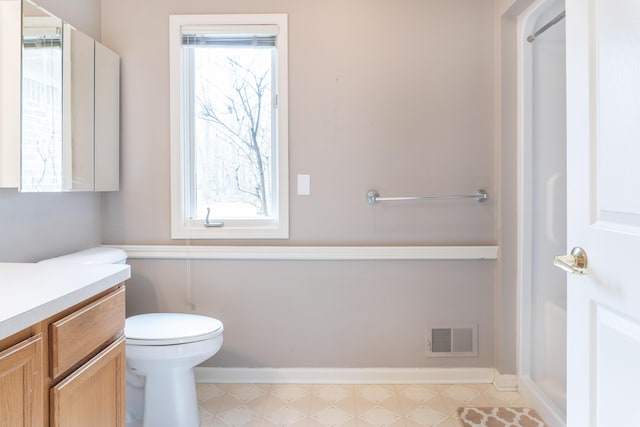 21329 Mulberry Ct, Farmington Hills, MI 48336 - bathroom featuring visible vents, toilet, vanity, and baseboards