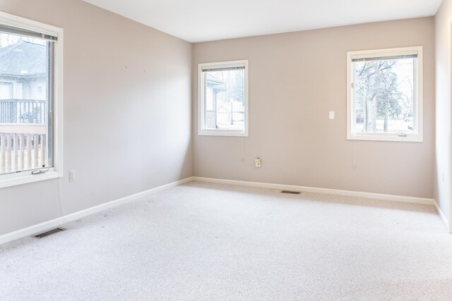 21329 Mulberry Ct, Farmington Hills, MI 48336 - spare room featuring visible vents, baseboards, and light colored carpet