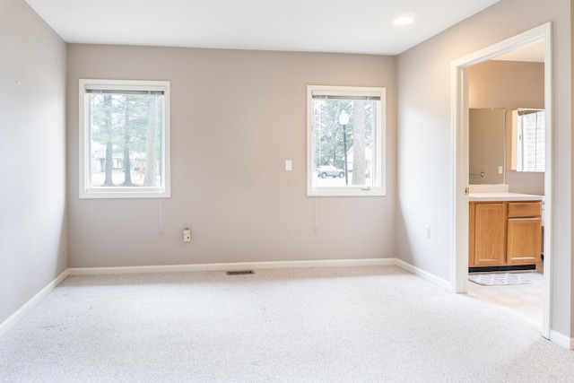 21329 Mulberry Ct, Farmington Hills, MI 48336 - unfurnished bedroom featuring light carpet, multiple windows, and baseboards