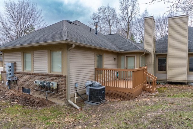 21329 Mulberry Ct, Farmington Hills, MI 48336 - back of house with central air condition unit, a wooden deck, and a shingled roof