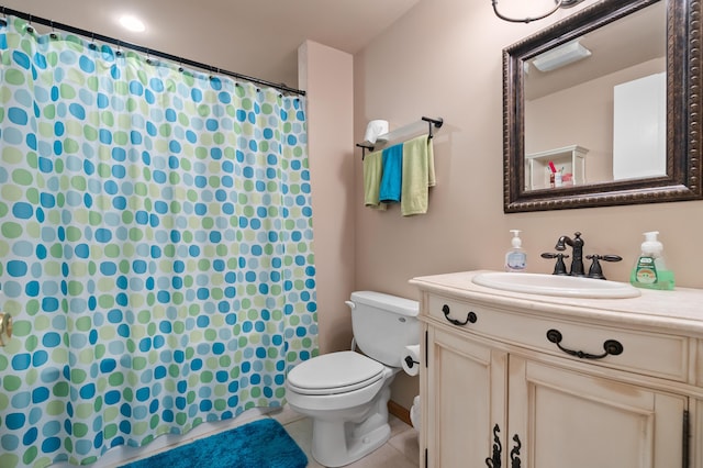 bathroom featuring tile patterned floors, vanity, a shower with curtain, and toilet