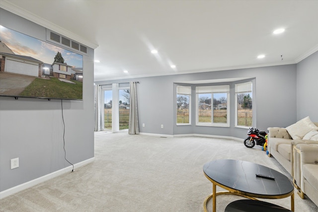 living area with crown molding, baseboards, light carpet, and recessed lighting