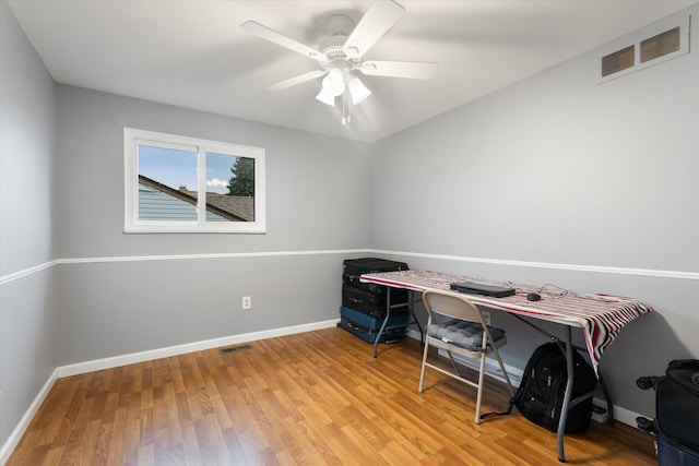 office area featuring light wood-type flooring, baseboards, and visible vents