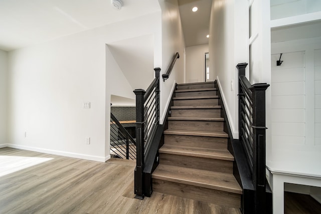 6522 Ellinwood Dr, White Lake, MI 48383 - stairs featuring wood finished floors, baseboards, and recessed lighting