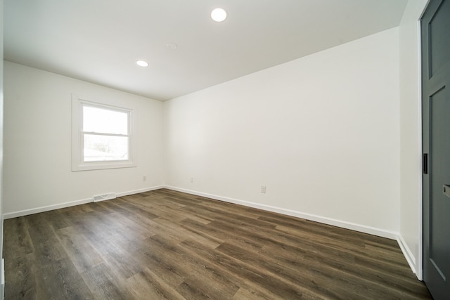 6522 Ellinwood Dr, White Lake, MI 48383 - unfurnished room with dark wood-style flooring, visible vents, baseboards, and recessed lighting