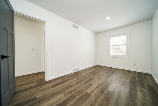 6522 Ellinwood Dr, White Lake, MI 48383 - unfurnished room featuring visible vents, baseboards, and dark wood finished floors