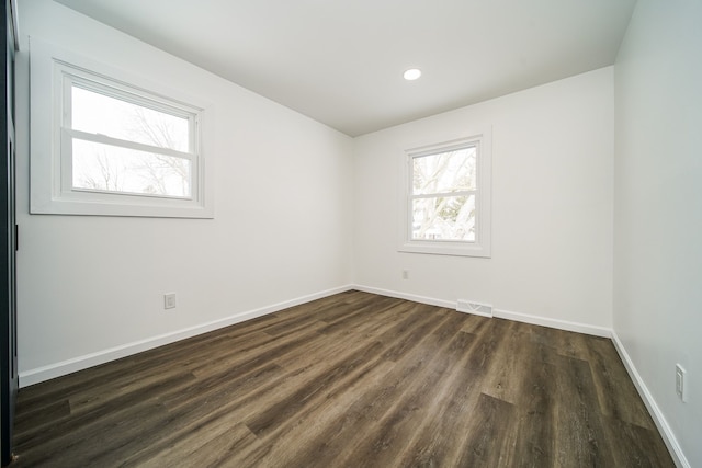 6522 Ellinwood Dr, White Lake, MI 48383 - unfurnished room with dark wood-type flooring, visible vents, baseboards, and recessed lighting