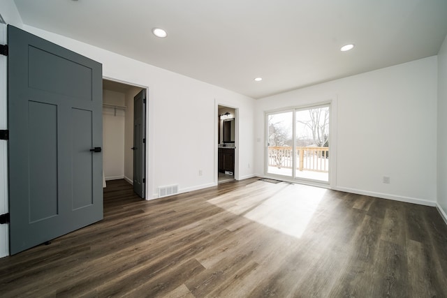 6522 Ellinwood Dr, White Lake, MI 48383 - unfurnished bedroom featuring visible vents, baseboards, dark wood-style flooring, recessed lighting, and access to outside