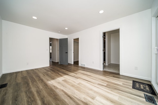 6522 Ellinwood Dr, White Lake, MI 48383 - unfurnished bedroom featuring wood finished floors, baseboards, visible vents, and recessed lighting