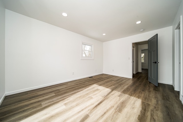 6522 Ellinwood Dr, White Lake, MI 48383 - unfurnished bedroom with baseboards, recessed lighting, and dark wood-style floors