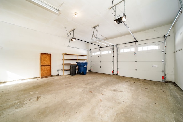 6522 Ellinwood Dr, White Lake, MI 48383 - garage featuring a garage door opener