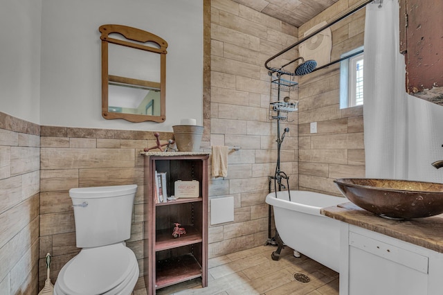 6357 Baldwin Rd, Swartz Creek, MI 48473 - bathroom featuring toilet, a shower, a bathtub, and tile walls