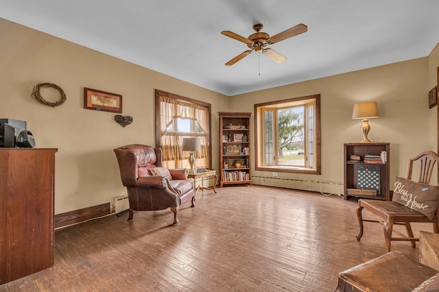 6357 Baldwin Rd, Swartz Creek, MI 48473 - sitting room with plenty of natural light, baseboard heating, a baseboard heating unit, and a ceiling fan