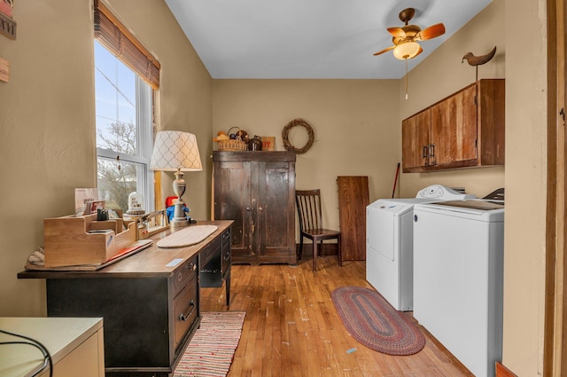6357 Baldwin Rd, Swartz Creek, MI 48473 - washroom with cabinet space, light wood-type flooring, a ceiling fan, and washing machine and dryer