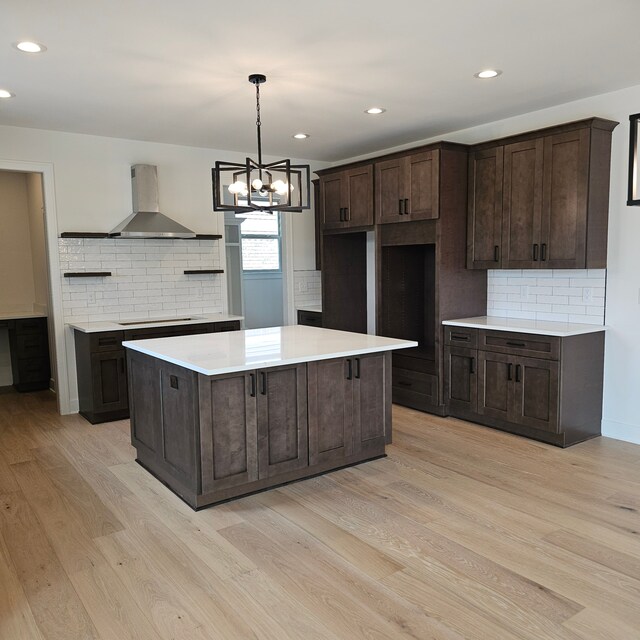 18468 Stallmann Dr, Macomb, MI 48042 - kitchen with wall chimney exhaust hood, open shelves, dark brown cabinetry, light wood-style floors, and backsplash