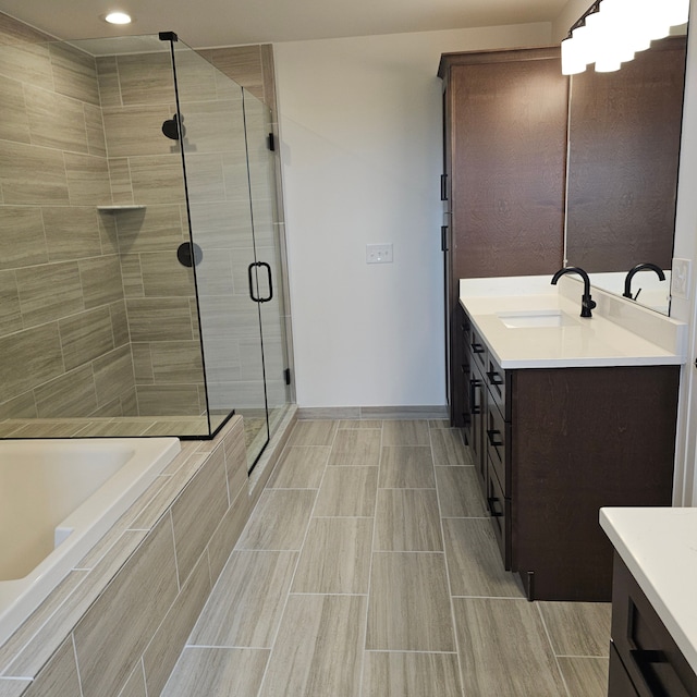 18468 Stallmann Dr, Macomb, MI 48042 - full bath featuring vanity, a stall shower, tiled bath, baseboards, and recessed lighting